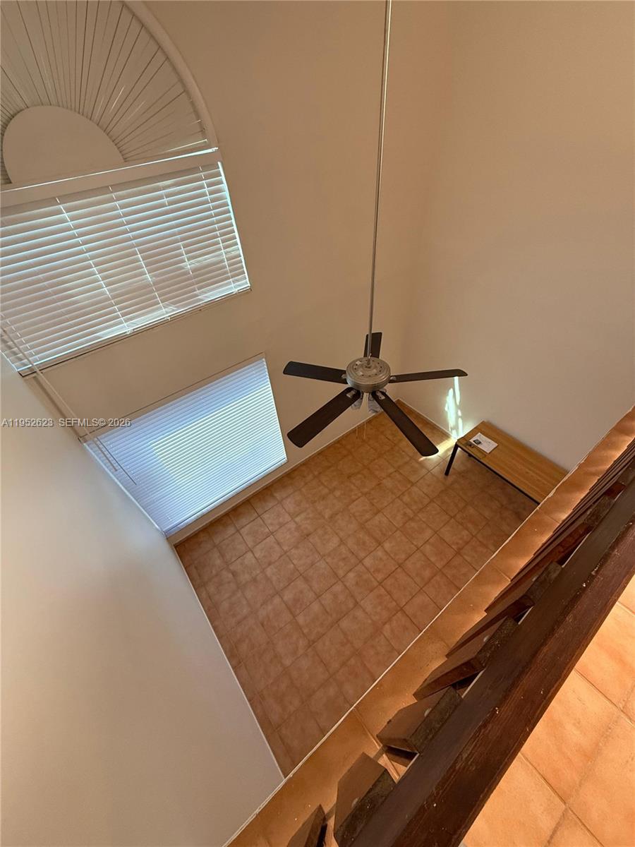 10641 Southwest 108th Avenue, Unit 3I Miami, FL 33176 - Photo 15 of 25 a view of a room with projector and a window