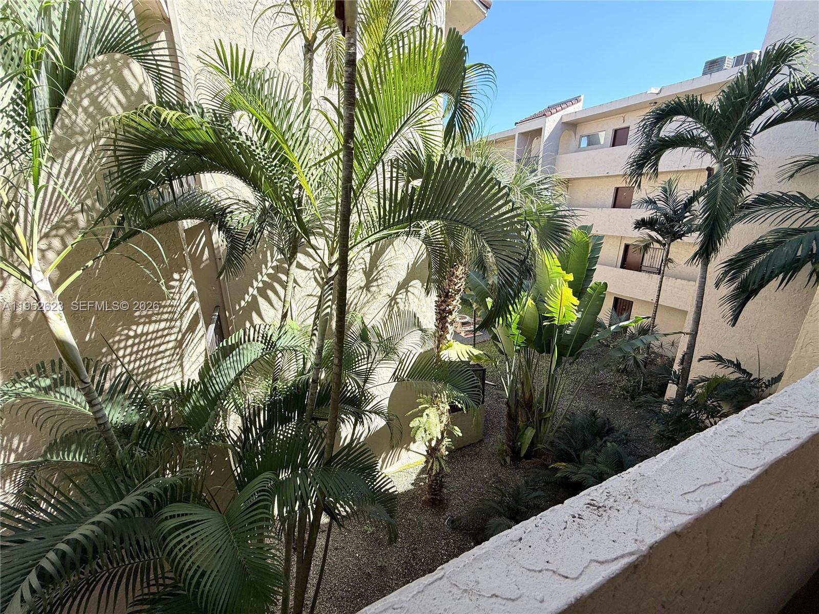 10641 Southwest 108th Avenue, Unit 3I Miami, FL 33176 - Photo 18 of 25 a view of multiple house with yard
