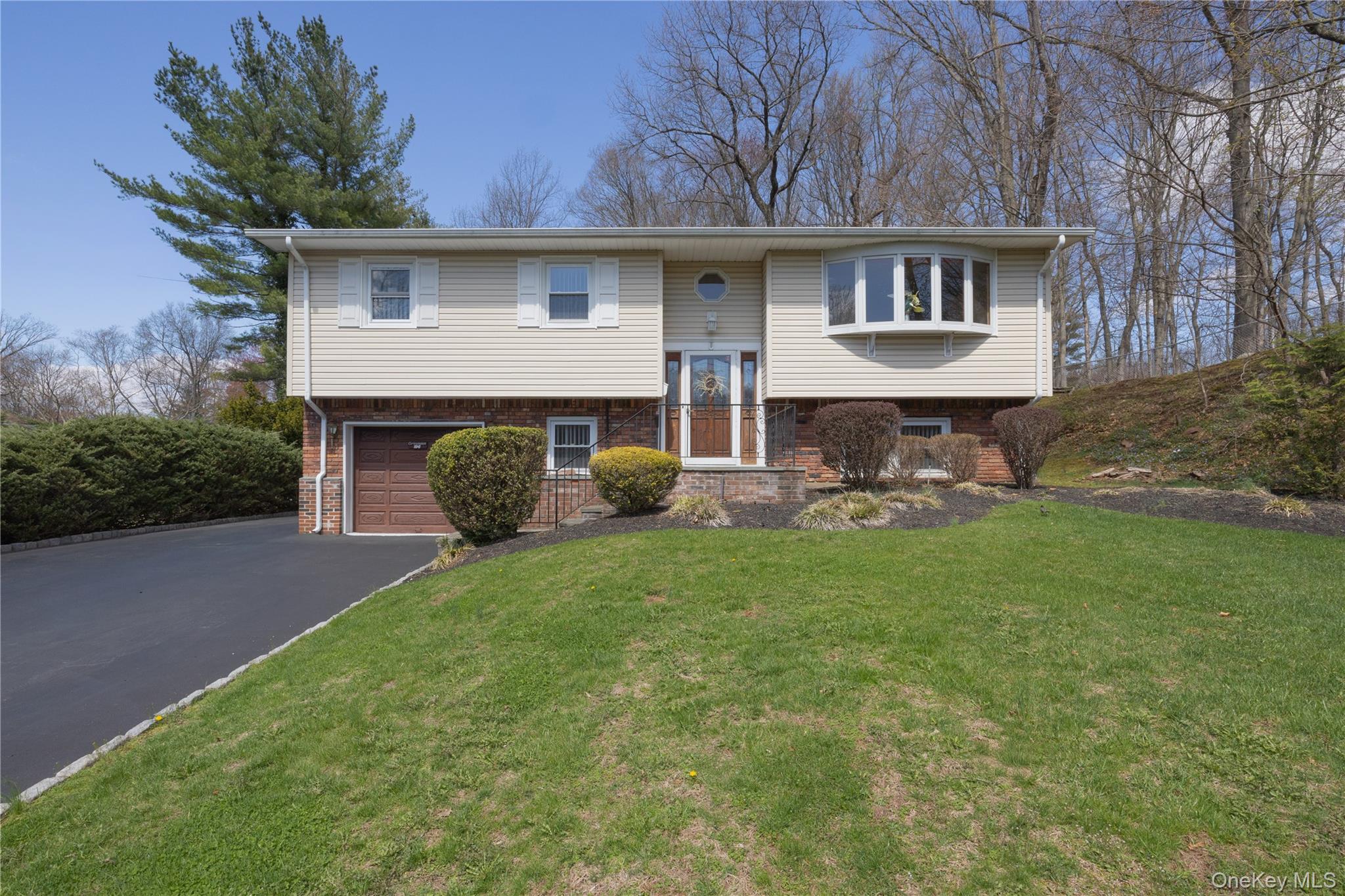 196 East Townline Road West Nyack, NY 10994 - Photo 1 of 35 a front view of a house with garden