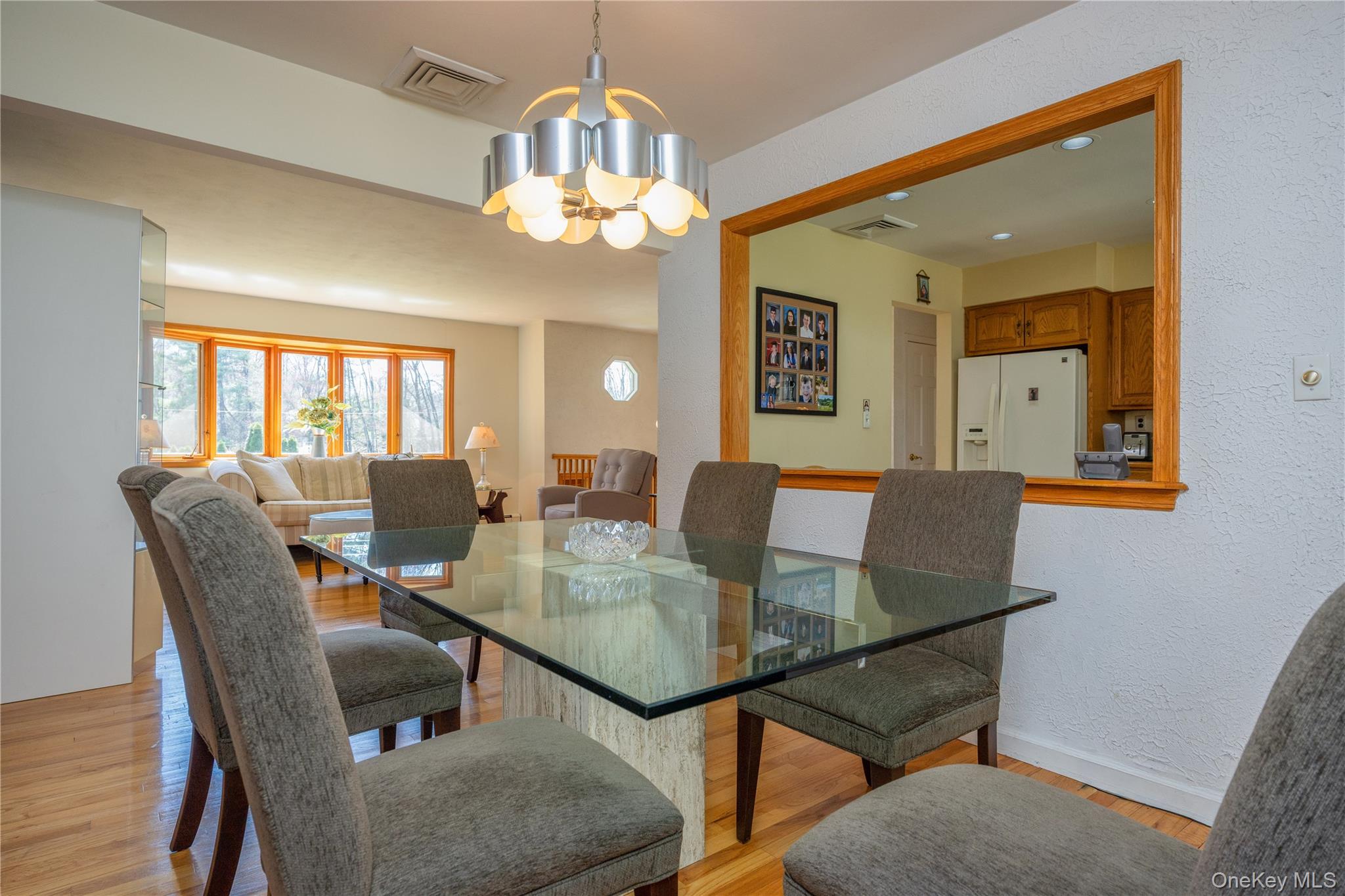 196 East Townline Road West Nyack, NY 10994 - Photo 12 of 35 a view of a dining room with furniture and chandelier