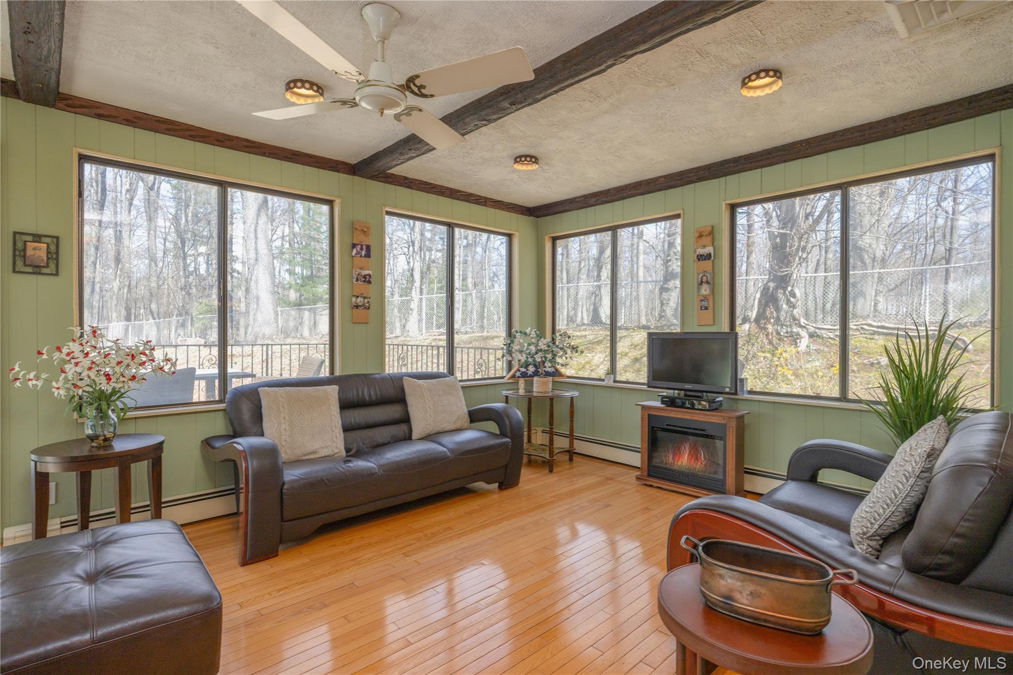 196 East Townline Road West Nyack, NY 10994 - Photo 13 of 35 a living room with furniture and a floor to ceiling window
