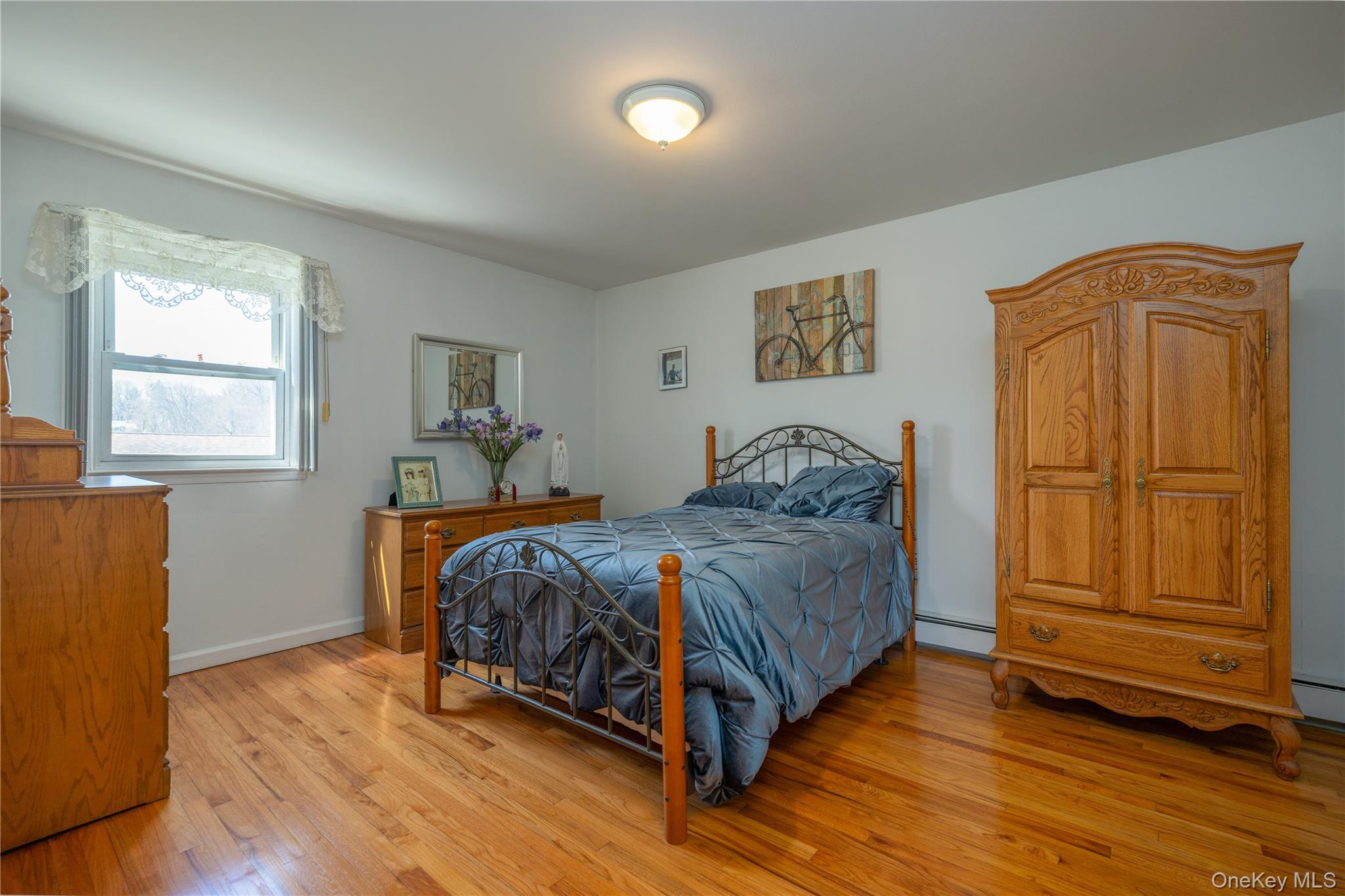 196 East Townline Road West Nyack, NY 10994 - Photo 16 of 35 a bedroom with a bed and wooden floor