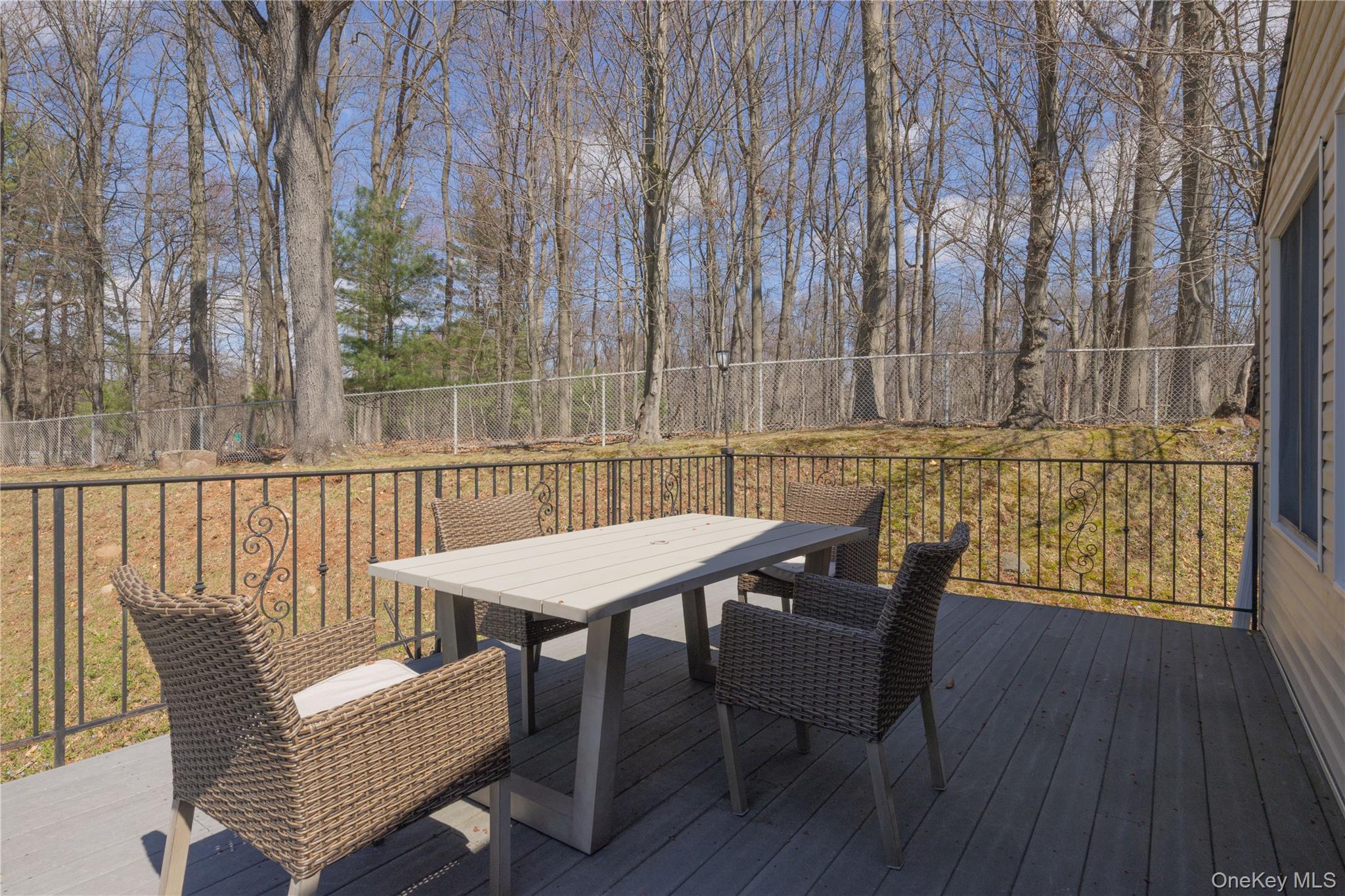 196 East Townline Road West Nyack, NY 10994 - Photo 28 of 35 a view of a chairs and table on the deck
