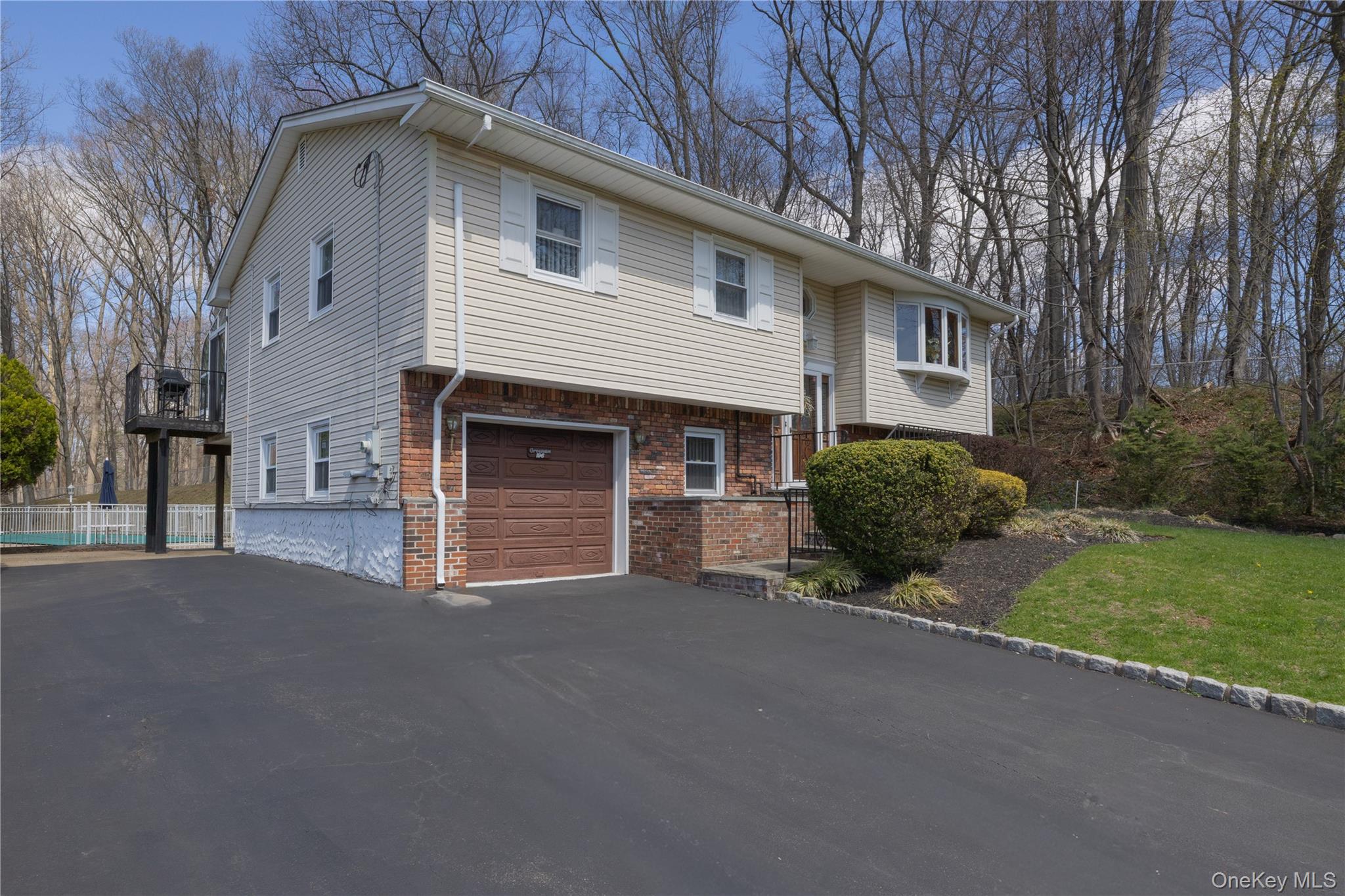 196 East Townline Road West Nyack, NY 10994 - Photo 3 of 35 a front view of a house with a yard and garage