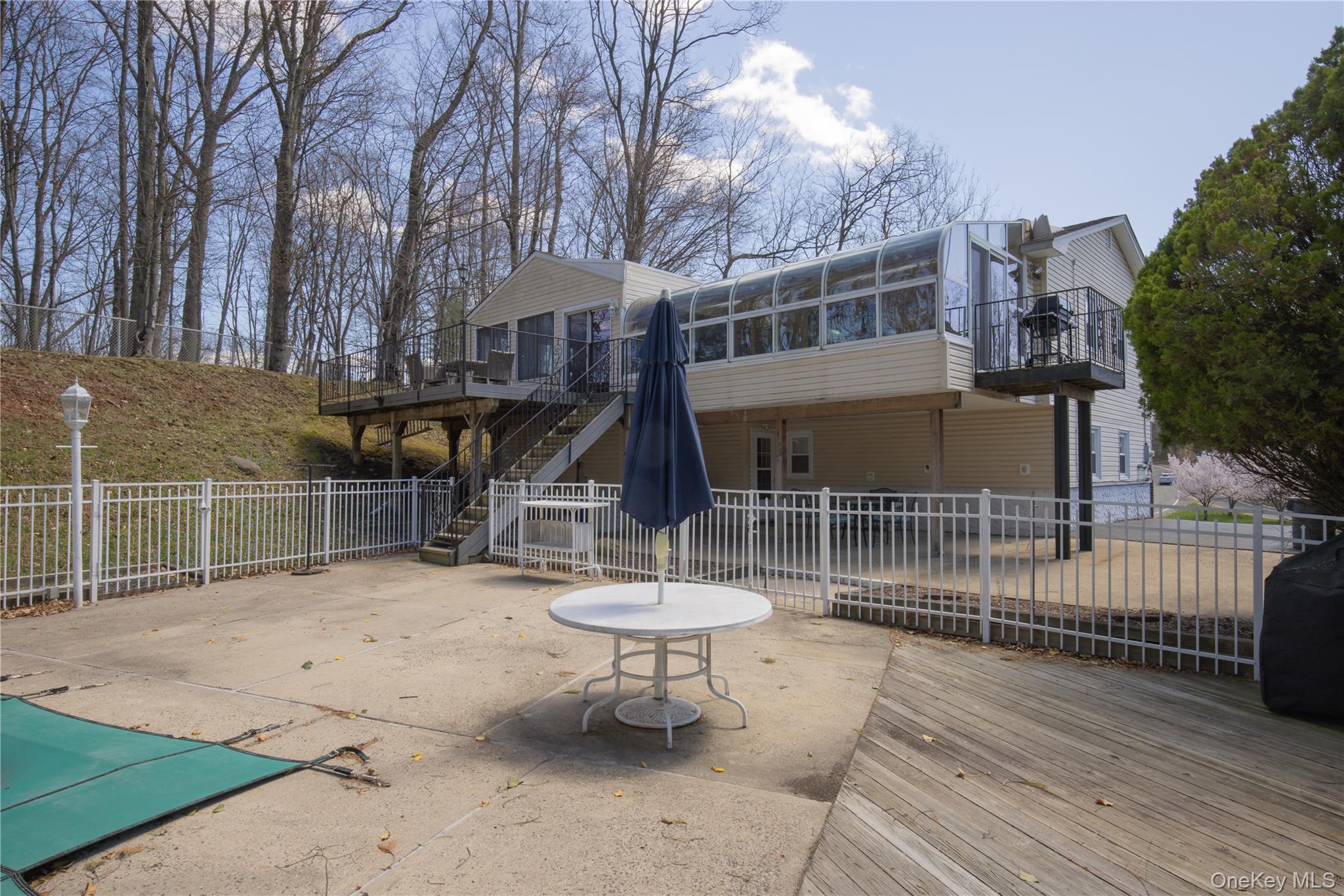 196 East Townline Road West Nyack, NY 10994 - Photo 33 of 35 a view of a chair and table in backyard