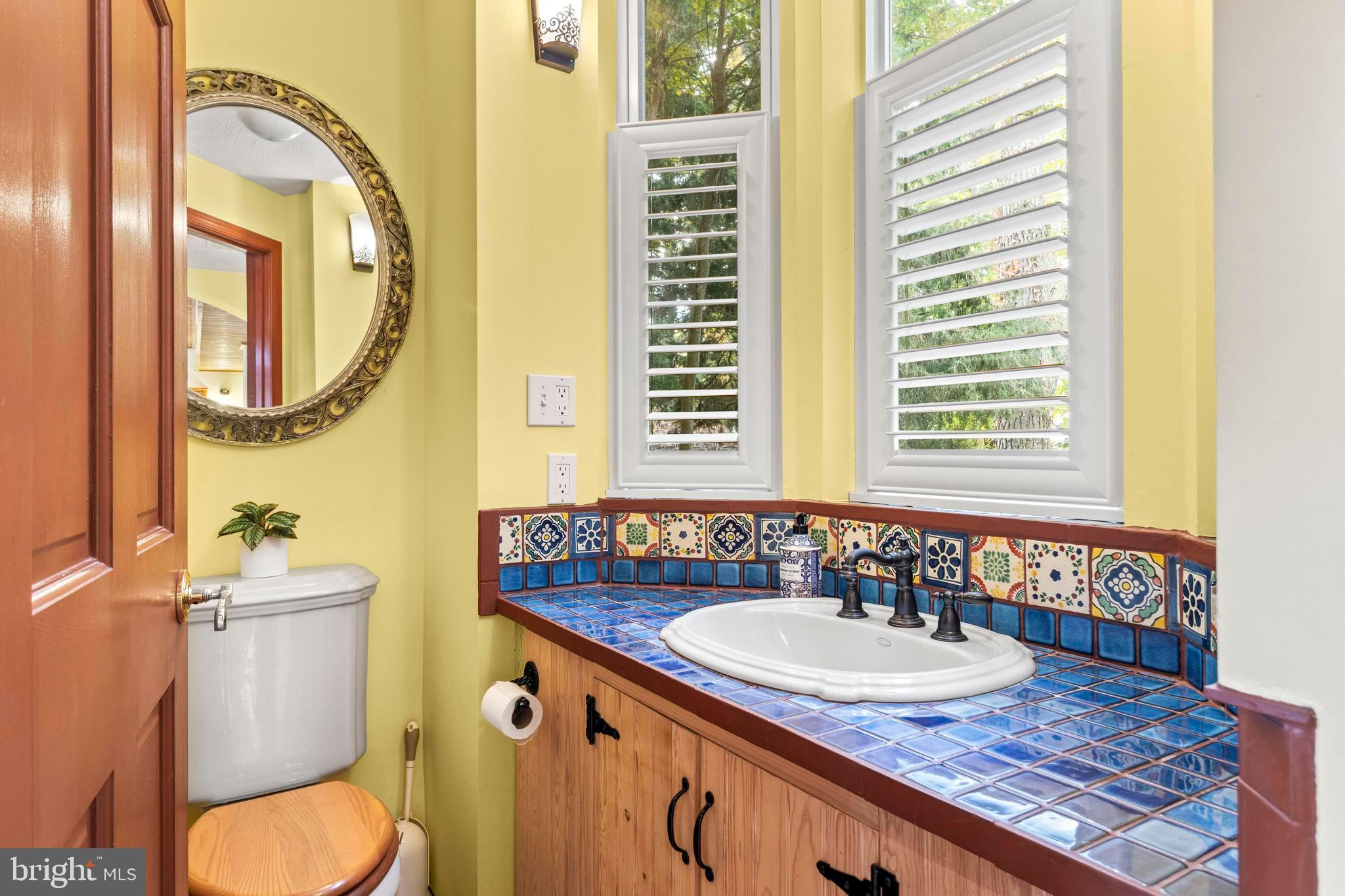 12330 Potomac View Road Newburg, MD 20664 - Photo 18 of 85 a bathroom with a granite countertop toilet sink and mirror
