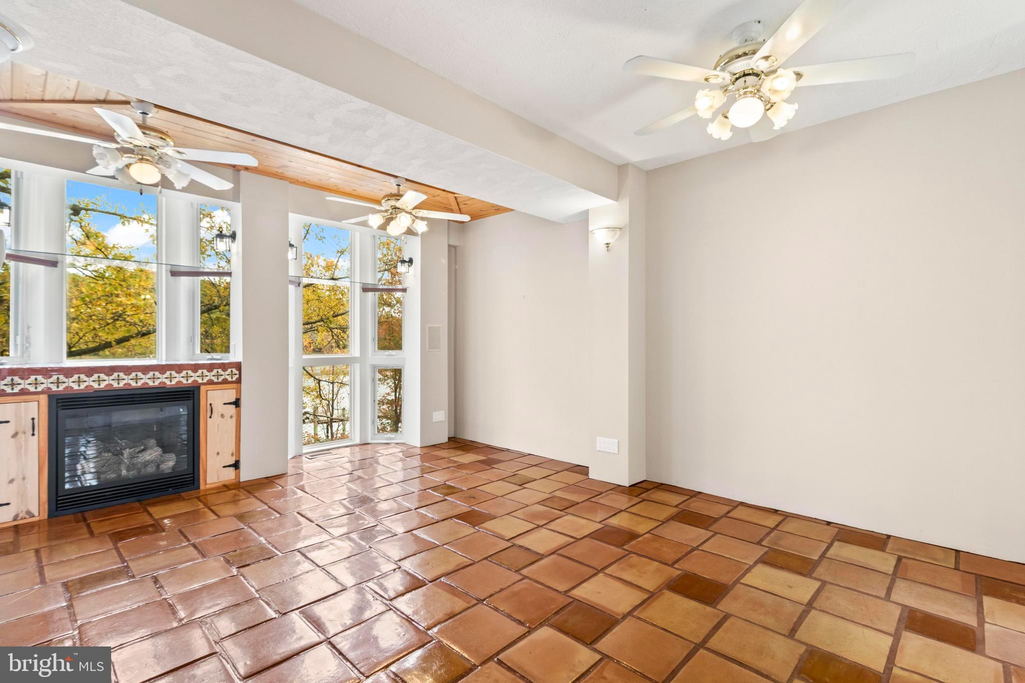 12330 Potomac View Road Newburg, MD 20664 - Photo 27 of 85 a bedroom with a bed and a fireplace