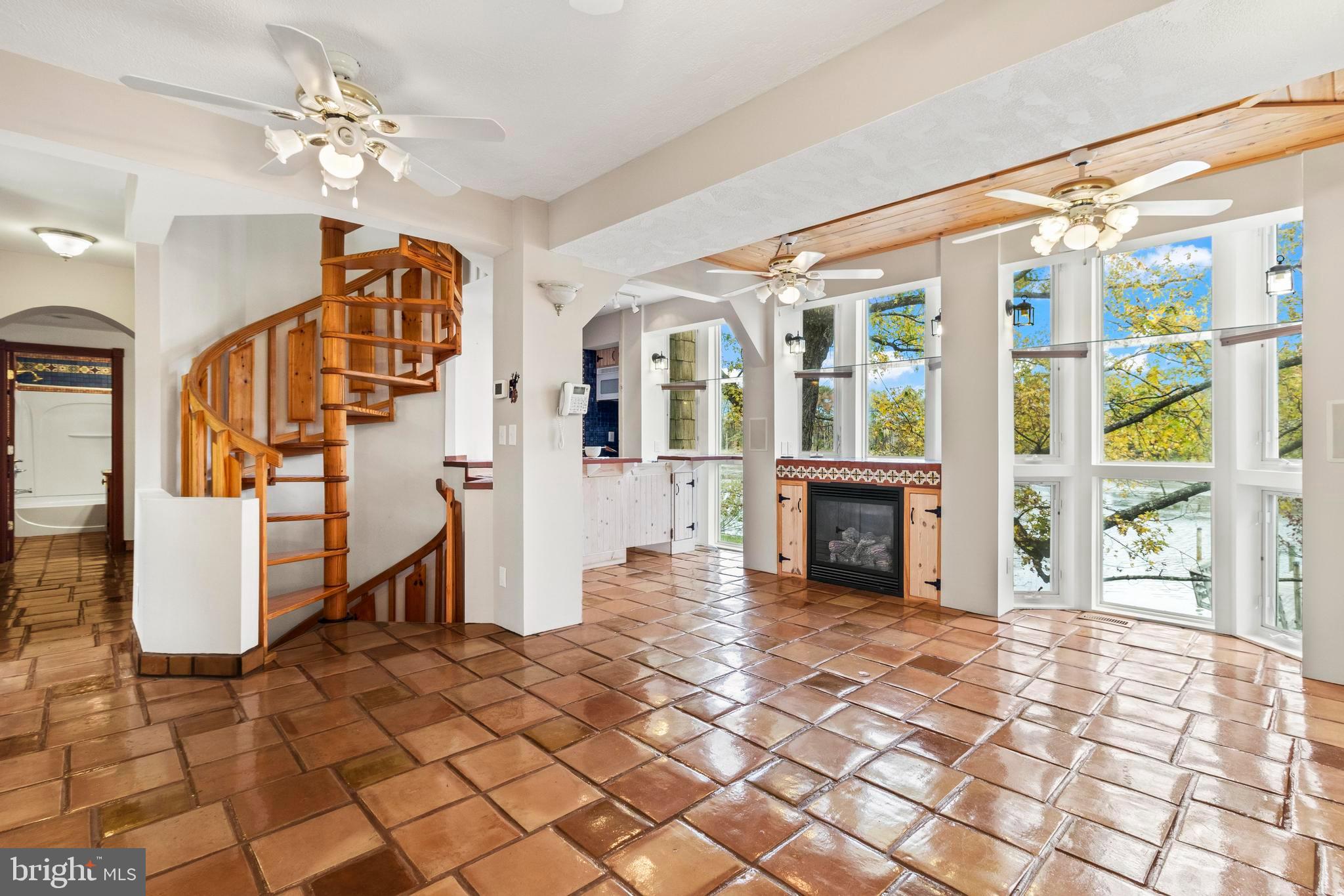 12330 Potomac View Road Newburg, MD 20664 - Photo 28 of 85 a view of a livingroom with furniture staircase and a kitchen