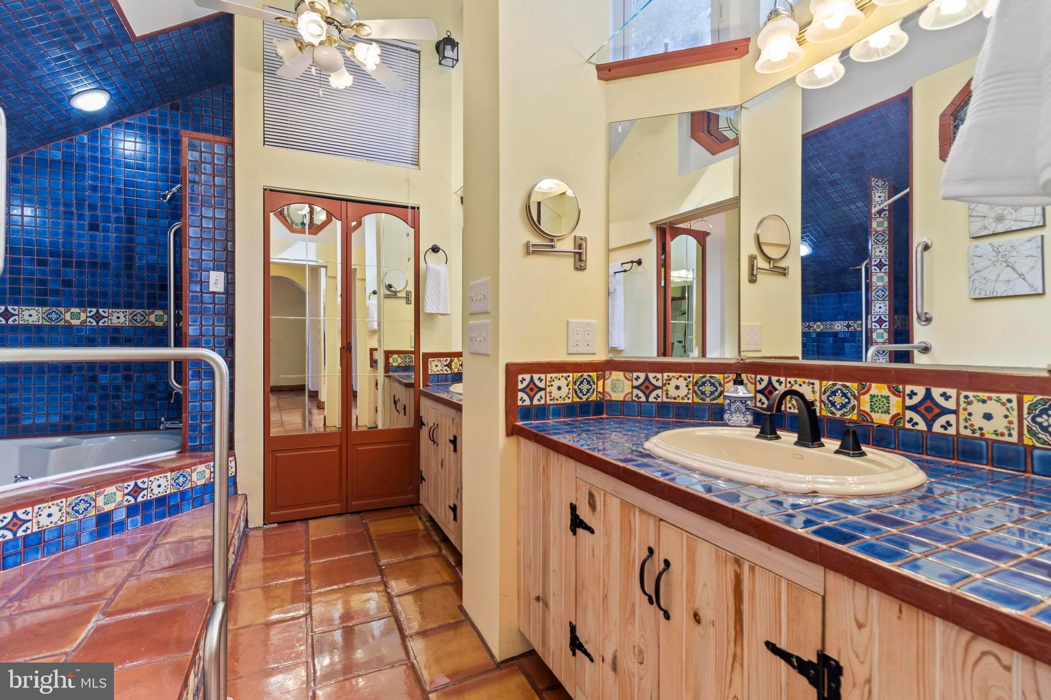 12330 Potomac View Road Newburg, MD 20664 - Photo 49 of 85 a bathroom with a sink a large mirror and a shower