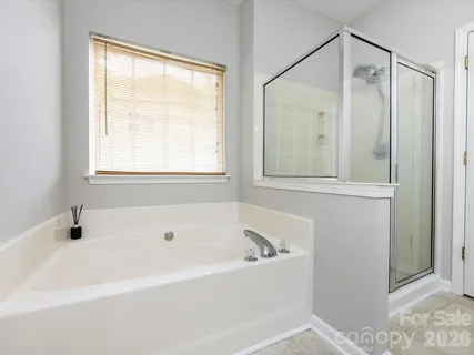 a white bath tub sitting next to a window