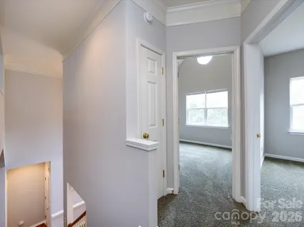wooden floor with a bathroom