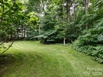 a view of outdoor space with deck and yard