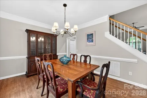 a view of a dining room and a table chairs