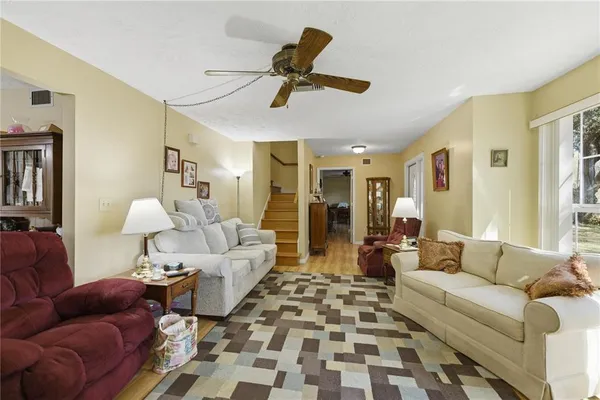 a living room with furniture and a rug