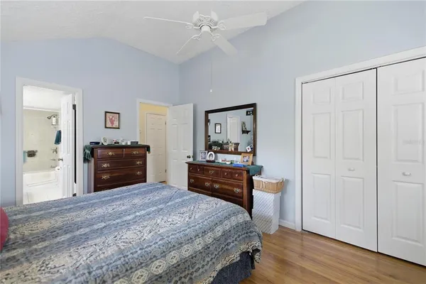 a bed room with a bed and a television