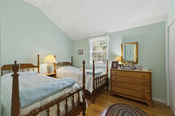 a bed room with a bed and a dresser