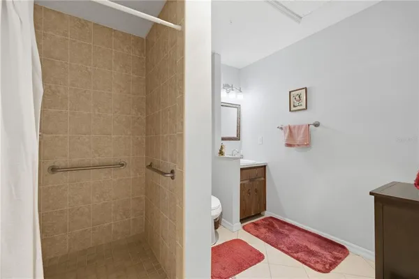 a bathroom with a shower and a toilet