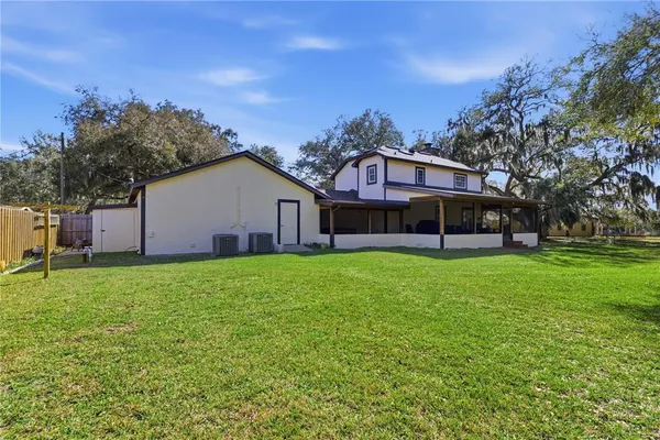 a view of a house with a big yard
