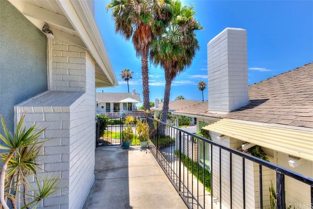 a view of a balcony with plants