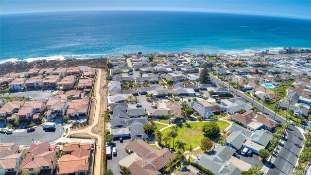 a view of a roof deck with wooden fence