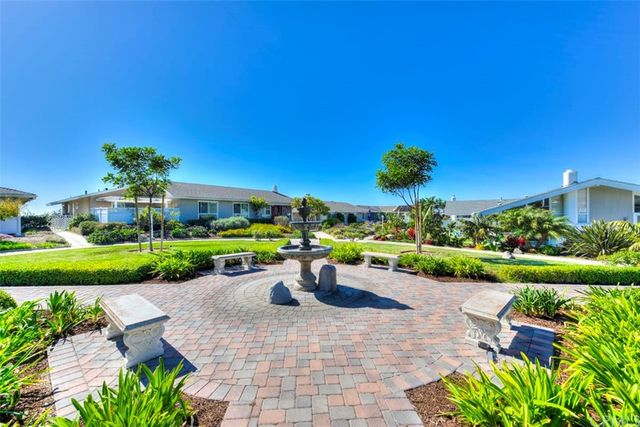 a view of a swimming pool with outdoor seating