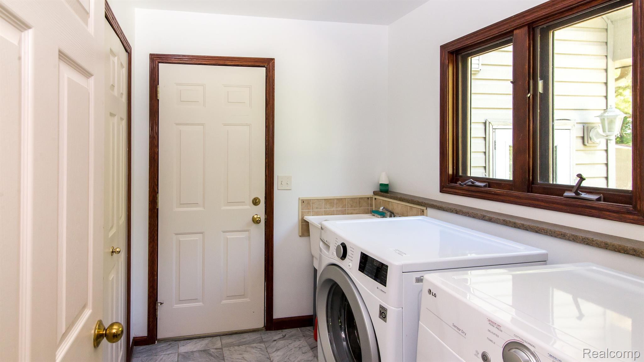 4197 Pinckney Road Howell, MI 48843 - Photo 15 of 34 1 st floor laundry