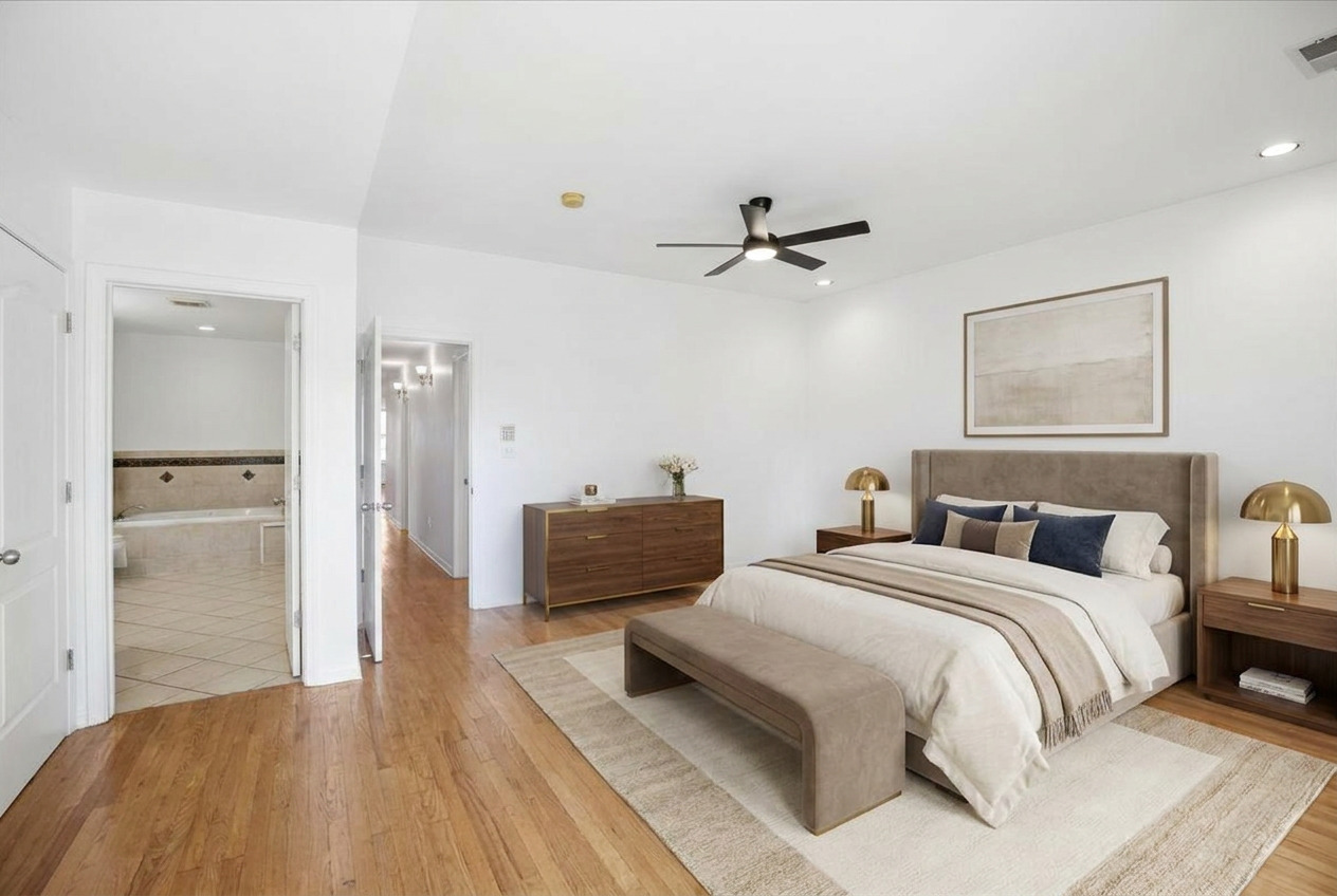 2363 East 70th Street, Unit 1 Chicago, IL 60649 - Photo 16 of 26 a bedroom with a bed and ceiling fan