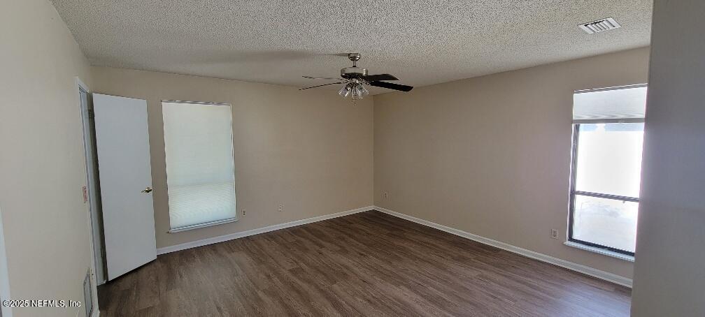 2321 Stonebridge Drive Orange Park, FL 32065 - Photo 11 of 21 wooden floor in an empty room with a window