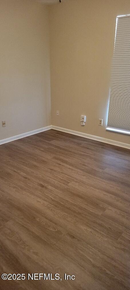 2321 Stonebridge Drive Orange Park, FL 32065 - Photo 16 of 21 a view of an empty room with wooden floor