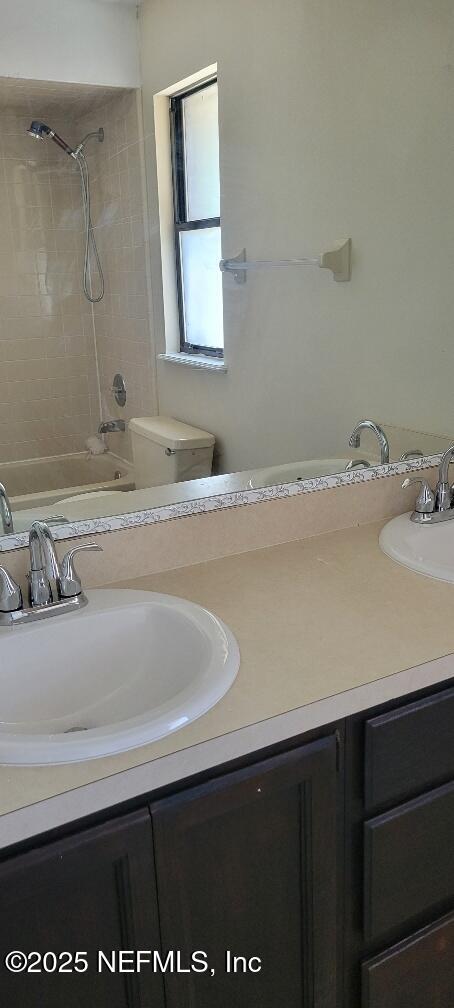 2321 Stonebridge Drive Orange Park, FL 32065 - Photo 17 of 21 a bathroom with a sink and a mirror