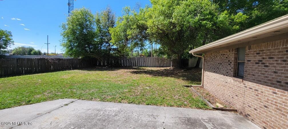 2321 Stonebridge Drive Orange Park, FL 32065 - Photo 19 of 21 a view of a backyard with a small cabin