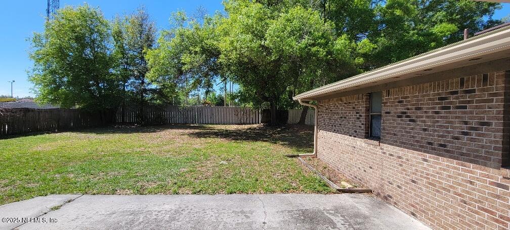 2321 Stonebridge Drive Orange Park, FL 32065 - Photo 20 of 21 a backyard of a house with lots of green space