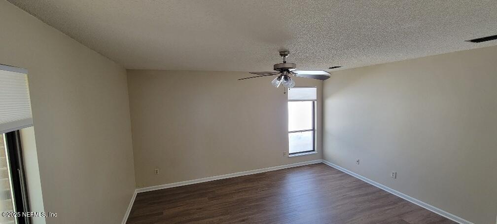 2321 Stonebridge Drive Orange Park, FL 32065 - Photo 10 of 21 an empty room with a window and a chandelier fan