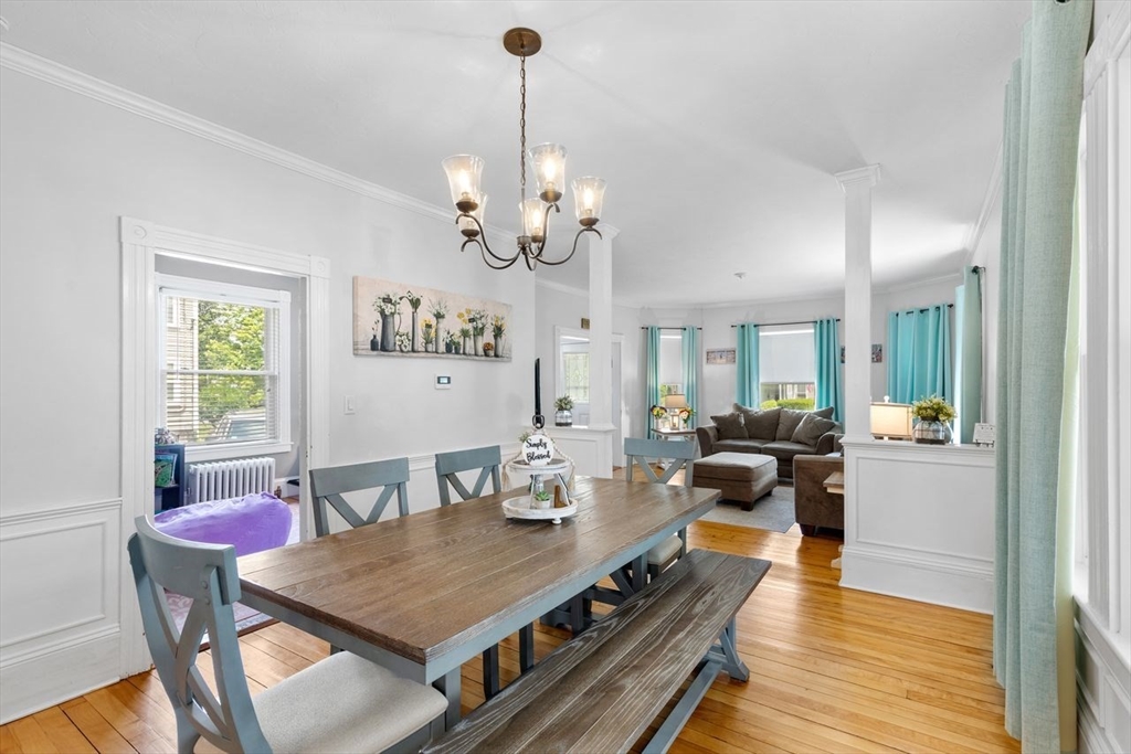 1012 Washington Street Whitman, MA 02382 - Photo 20 of 37 a view of a dining room with furniture a chandelier and wooden floor