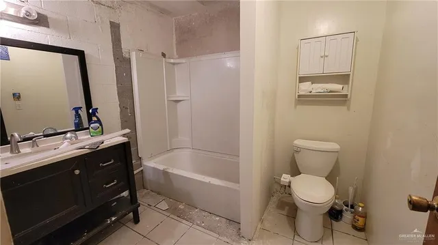 a view of storage and utility room with a door