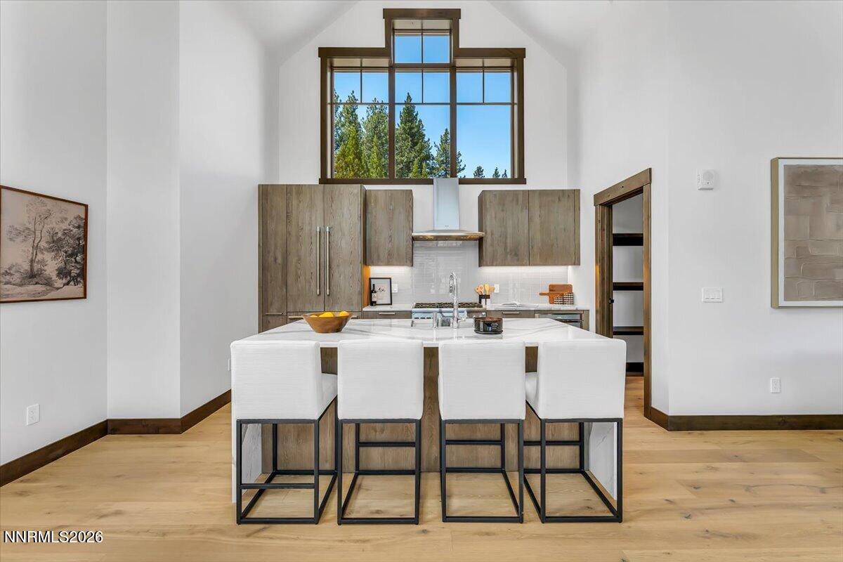 46 Beach Club Drive, Unit 905 Stateline, NV 89449 - Photo 10 of 37 a view of a dining room with furniture and wooden floor