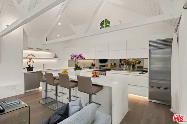 a view of kitchen with cabinets and wooden floor