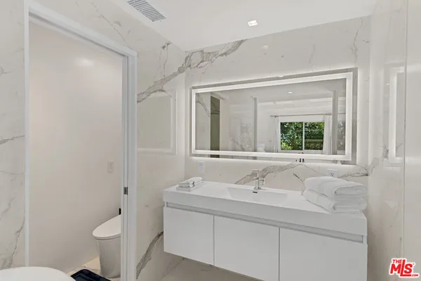 a bathroom with a sink and a toilet