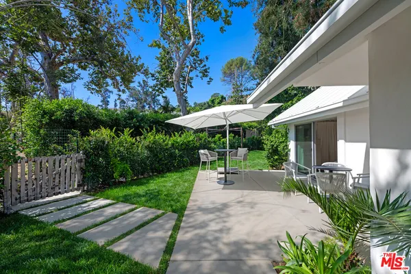 a garden view with a seating space