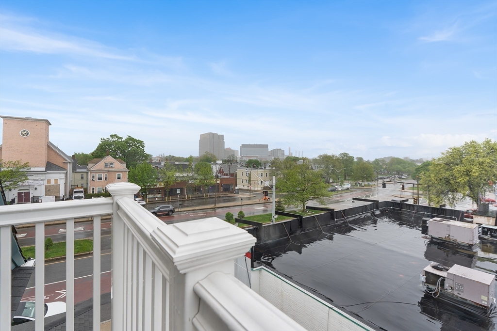 280 Broadway, Unit 5 Somerville, MA 02145 - Photo 4 of 13 a view of a city from a terrace