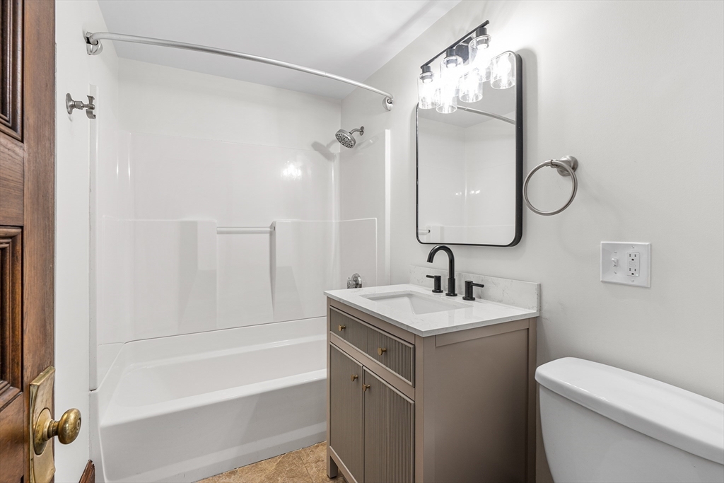 280 Broadway, Unit 5 Somerville, MA 02145 - Photo 7 of 13 a bathroom with a sink toilet and shower