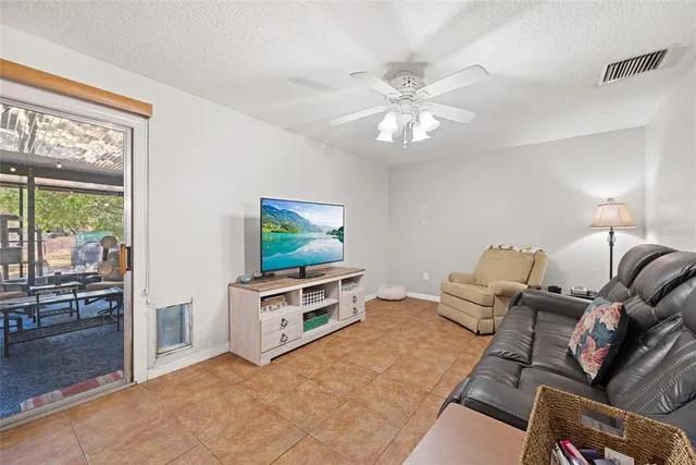 a living room with furniture and a lamp
