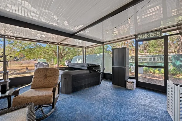 a bed sitting in a room next to a window
