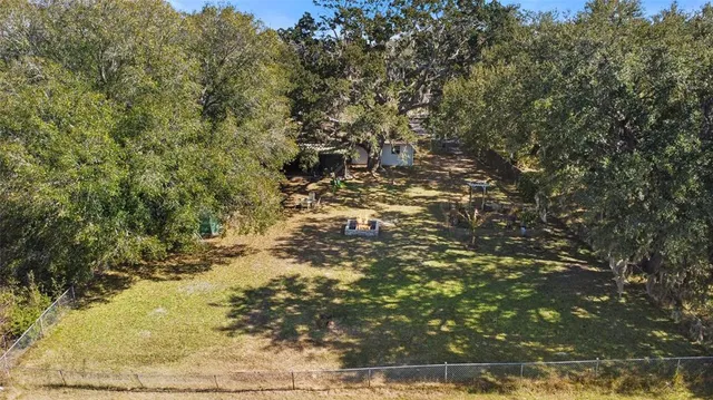 a view of a city with lush green forest