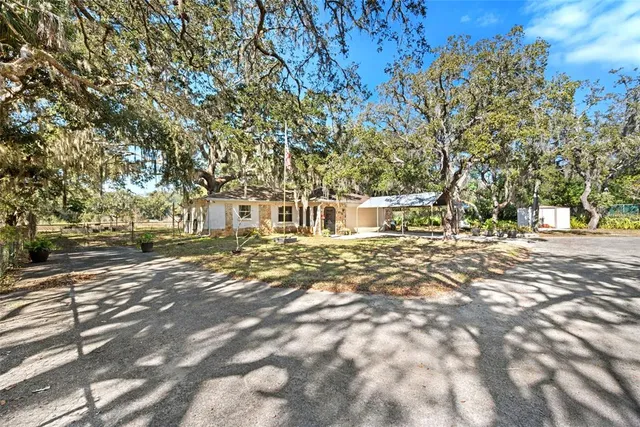 a view of a backyard of a house