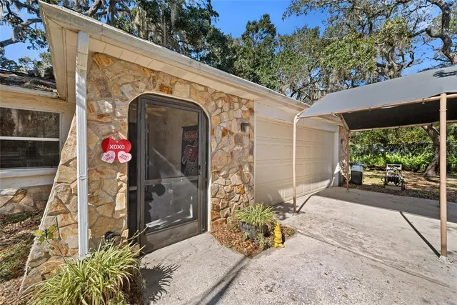 a view of a backyard with sitting area