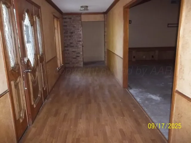 a view of entryway with wooden floor