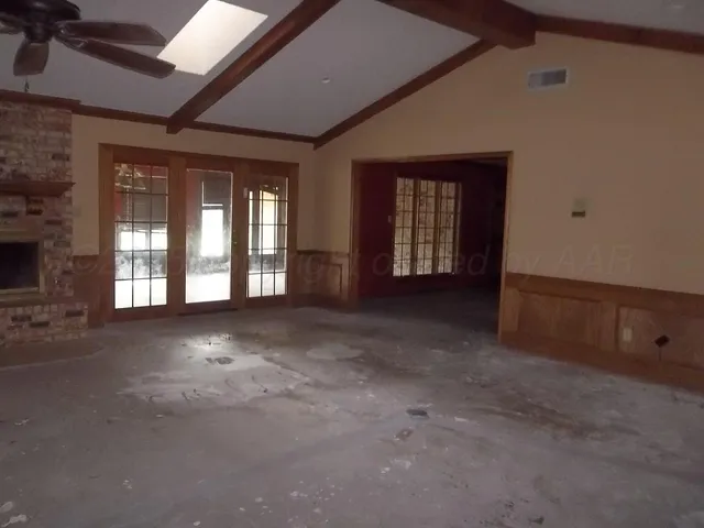 a view of a room with large windows