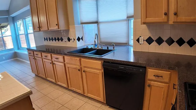 an empty room with wooden floor and closet