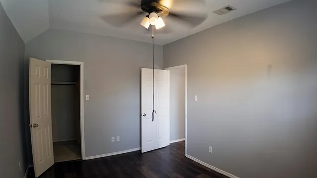 a view of barbeque area with brick walls